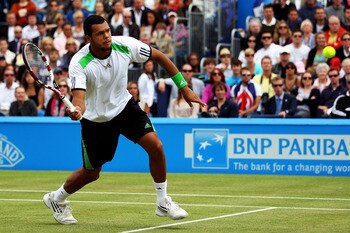 LONDON, ENGLAND - JUNE 13:  Jo-Wilfred Tsonga of France eyes the ball during his Men's Singles final against Andy Murray of Great Britain on day eight of the AEGON Championships at Queens Club on June 13, 2011 in London, England.  (Photo by Clive Brunskil