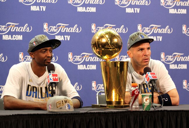 MIAMI, FL - JUNE 12:  Jason Terry #31 and Jason Kidd #2 of the Dallas Mavericks answer questions from the media as the Larry O'Brien Championship trophy sits on the table during a post game news conference after the Mavericks won 105-95 against the Miami