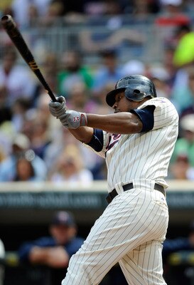 MINNEAPOLIS, MN - JUNE 11: Delmon Young #21 of the Minnesota Twins singles against the Texas Rangers during the first inning of their game on June 11, 2011 at Target Field in Minneapolis, Minnesota. The Twins defeated the Rangers 8-1. (Photo by Hannah Fos
