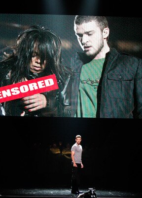 LOS ANGELES, CA - JULY 16:  Host Justin Timberlake stands onstage in front of a video of himself and Janet Jackson from Super Bowl XXXVIII onstage at the 2008 ESPY Awards held at NOKIA Theatre L.A. LIVE on July 16, 2008 in Los Angeles, California.  The 20