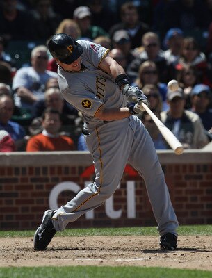 CHICAGO, IL - MAY 27: Matt Diaz #23 of the Pittsburgh Pirates hits the ball against the Chicago Cubs at Wrigley Field on May 27, 2011 in Chicago, Illinois. The Pirates defeated the Cubs 4-2. (Photo by Jonathan Daniel/Getty Images)