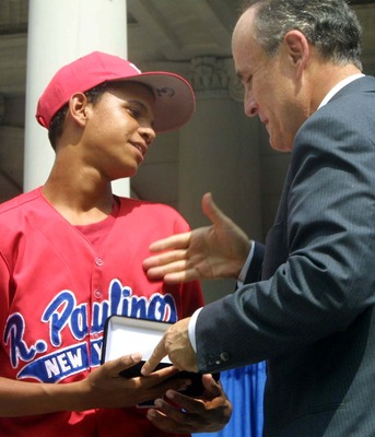 393788 03: Danny Almonte of the Rolando Paulino All-Stars Bronx Little League baseball team is presented with a key to the city by Mayor Rudolph Giuliani during a ceremony honoring the team August 28, 2001 in New York City. The team, which finished third