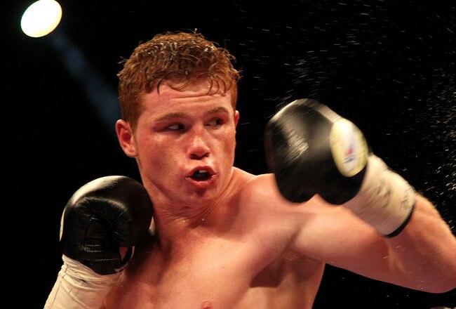 LAS VEGAS - MAY 01:  (L-R) Saul Alvarez of Mexico connects to the head of Jose Miguel Cotto of Puerto Rico during the welterweight fight at the MGM Grand Garden Arena on May 1, 2010 in Las Vegas, Nevada.  (Photo by Jed Jacobsohn/Getty Images)