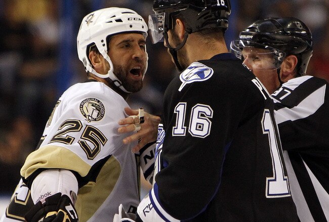 TAMPA, FL - APRIL 25: Maxime Talbot #25 of the Pittsburgh Penguins has a disagreement with Teddy Purcell #16 of the Tampa Bay Lightning in Game Six of the Eastern Conference Quarterfinals during the 2011 NHL Stanley Cup Playoffs at the St. Pete Times Foru