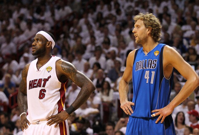 MIAMI, FL - JUNE 12: (L-R) LeBron James #6 of the Miami Heat and Dirk Nowitzki #41 of the Dallas Mavericks look on in Game Six of the 2011 NBA Finals at American Airlines Arena on June 12, 2011 in Miami, Florida. The Mavericks won 105-95. NOTE TO USER: Us