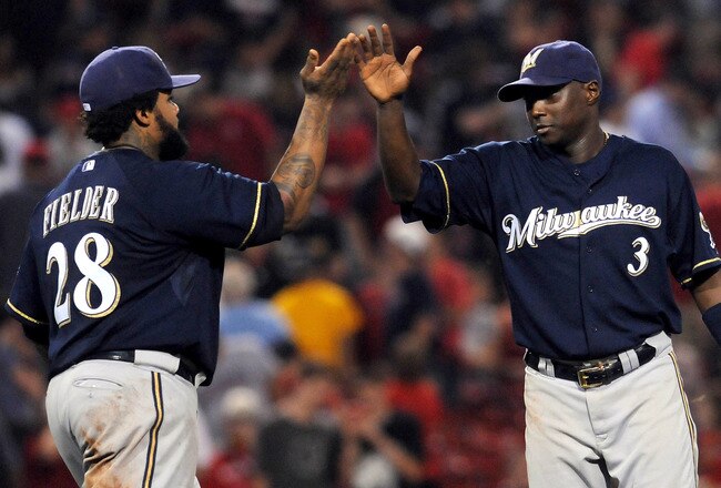 BOSTON, MA - JUNE 18:  Prince Fielder #28 and Yuniesky Betancourt #3 of the Milwaukee Brewers high five after their win against the Boston Red Sox at Fenway Park on June 18, 2011 in Boston, Massachusetts. The Brewers won the game 4-2. (Photo by Darren McC