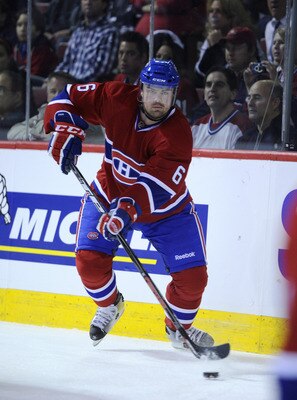 MONTREAL, CANADA - APRIL 21:  Jaroslav Spacek #6 of the Montreal Canadiens skates with the puck in Game Four of the Eastern Conference Quarterfinals against the Boston Bruins during the 2011 NHL Stanley Cup Playoffs at the Bell Centre on April 21, 2011 in