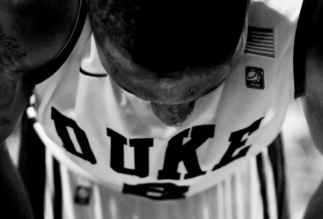 GREENSBORO, NC - MARCH 11:  (EDITORS NOTE: Image has been converted to black and white.) Nolan Smith #2 of the Duke Blue Devils stands on his feet after being injured during the second half of the game against the Maryland Terrapins in the quarterfinals o