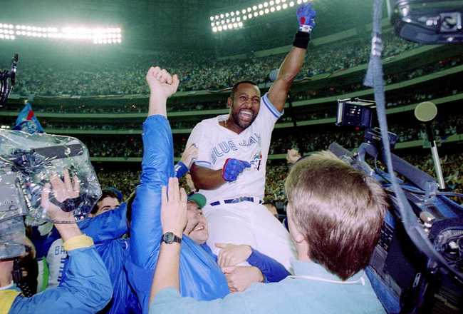 25 Oct 1993: Joe Carter is held aloft after hitting a three-run homer in the bottom of the ninth to win the World Series, four games to two, against the Philadelphia Phillies.