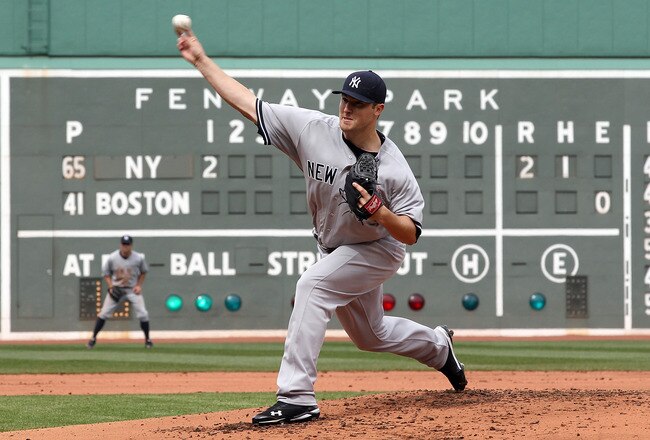 BOSTON, MA - APRIL 8:  Phil Hughes #65 of New York Yankees throws against the Boston Red Sox in the first inning on Opening Day at Fenway Park on April 8, 2011 in Boston, Massachusetts. (Photo by Jim Rogash/Getty Images)