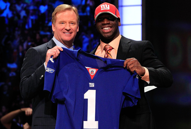 NEW YORK, NY - APRIL 28:  NFL Commissioner Roger Goodell (L) poses for a photo with Prince Amukamara, #19 overall pick by the New York Giants, on stage during the 2011 NFL Draft at Radio City Music Hall on April 28, 2011 in New York City.  (Photo by Chris