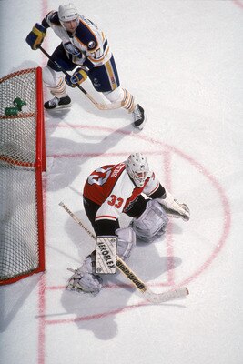 BUFFALO, NY - 1990:  Goalie Pete Peeters #33 of the Philadelphia Flyers follows the action as he protects the net during a game against the Buffalo Sabres in the 1990-1991 NHL season at Buffalo Memorial Auditorium in Buffalo, New York.  (Photo by Rick Ste