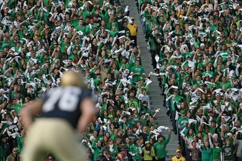 SOUTH BEND, IN - OCTOBER 17: Student fans of the Notre Dame Fighting Irish wave towels before a kick-off against the USC Trojans at Notre Dame Stadium on October 17, 2009 in South Bend, Indiana. USC defeated Notre Dame 34-27. (Photo by Jonathan Daniel/Get