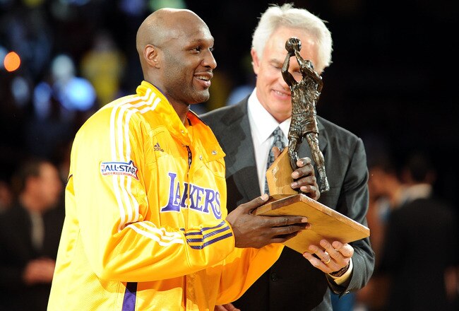 LOS ANGELES, CA - APRIL 20:  Lamar Odom #7 of the Los Angeles Lakers receives the Kia Six Man of the Year Award from Lakers General Manager Mitch Kupchak before Game Two of the Western Conference Quarterfinals in the 2011 NBA Playoffs against the New Orle