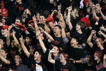 PISCATAWAY, NJ - OCTOBER 08:  Rutgers Scarlet Knights fans cheer on their team as they play the Connecticut Huskies at Rutgers Stadium on October 8, 2010 in Piscataway, New Jersey. Rutgers defeated UConn 27-24.  (Photo by Jim McIsaac/Getty Images)