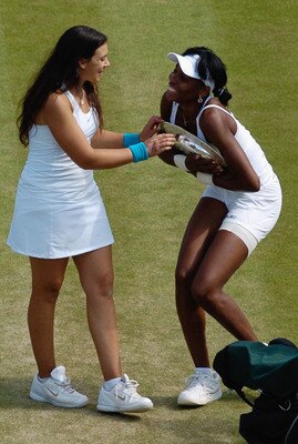 LONDON - JULY 07:  Venus Williams of USA jokes with Marion Bartoli of France following the Women's Singles final match during day twelve of the Wimbledon Lawn Tennis Championships at the All England Lawn Tennis and Croquet Club on July 7, 2007 in London, 