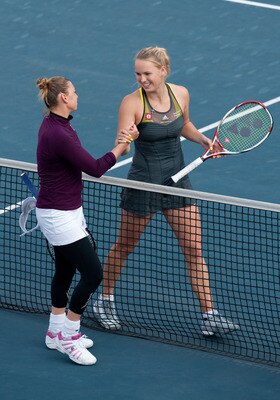 HONG KONG - JANUARY 08:  Caroline Wozniacki (R) of Denmark congratulates Vera Zvonareva of Russia at the end of their match during day four of the Hong Kong Tennis Classic 2011 on January 8, 2011 in Hong Kong, China.  (Photo by Victor Fraile/Getty Images)