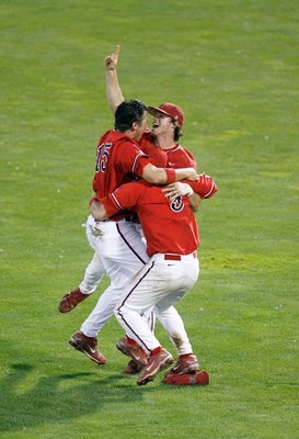 OMAHA, NE - JUNE 25:  Steve Detwiler #15 of the Fresno State Bulldogs celebrates with Erik Wetzel #3 and Alan Ahmady #9 against the Georgia Bulldogs during Game 3 of the 2008 Men's College World Series Championship June 25, 2008 at Rosenblatt Stadium in O