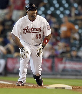 HOUSTON - JUNE 16:  Carlos Lee #45 of the Houston Astros reacts after being called out at first base on a close call that ended the game against the  Pittsburgh Pirates at Minute Maid Park on June 16, 2011 in Houston, Texas.  (Photo by Bob Levey/Getty Ima