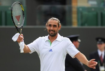 LONDON, ENGLAND - JUNE 23:  Marcos Baghdatis of Cyprus celebrates after winning his second round match against Andreas Seppi of Italy on Day Four of the Wimbledon Lawn Tennis Championships at the All England Lawn Tennis and Croquet Club on June 23, 2011 i