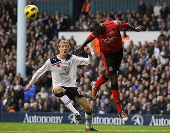 LONDON, ENGLAND - NOVEMBER 13:  Chris Samba of Blackburn heads clear of Peter Crouch of Tottenham during the Barclays Premier League match between Tottenham Hotspur and Blackburn Rovers at White Hart Lane on November 13, 2010 in London, England.  (Photo b