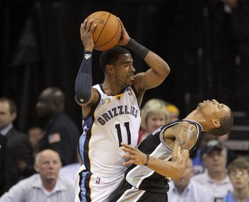 MEMPHIS, TN - APRIL 23:  23:  Mike Conley #11  of the  Memphis Grizziles is defended by George Hill #3 of the San Antonio Spurs in Game three of the Western Conference Quarterfinals in the 2011 NBA Playoffs at FedExForum on April 23, 2011 in Memphis, Tenn