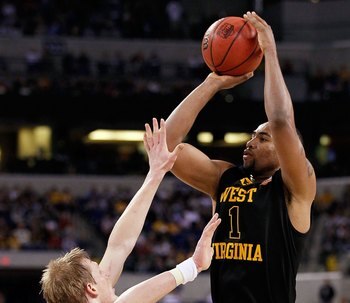 INDIANAPOLIS - APRIL 03:  Da'Sean Butler #1 of the West Virginia Mountaineers shoots over Kyle Singler #15 of the Duke Blue Devils during the National Semifinal game of the 2010 NCAA Division I Men's Basketball Championship at Lucas Oil Stadium on April 3