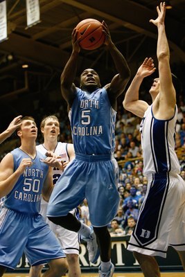 DURHAM, NC - FEBRUARY 11:  Ty Lawson #5 of the North Carolina Tar Heels goes up with the ball against Brian Zoubek #55 of the Duke Blue Devils during the game on February 11, 2009 at Cameron Indoor Stadium in Durham, North Carolina.  (Photo by Kevin C. Co
