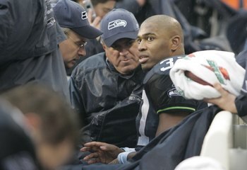 SEATTLE - JANUARY 14:  Running back Shaun Alexander #37 of the Seattle Seahawks rests on the sideline following an injury in the first quarter of the Seahawks' the NFC Divisional Playoff game against the Washington Redskins at Qwest Field on January 14, 2