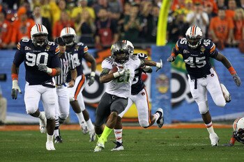 GLENDALE, AZ - JANUARY 10:  LaMichael James #21 of the Oregon Ducks runs against the Auburn Tigers during the Tostitos BCS National Championship Game at University of Phoenix Stadium on January 10, 2011 in Glendale, Arizona.  (Photo by Jonathan Ferrey/Get