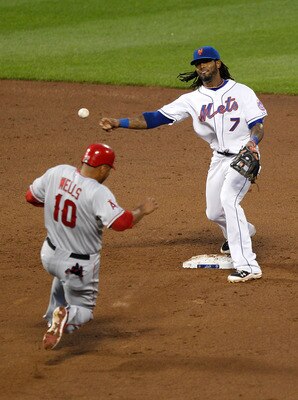 NEW YORK - JUNE 17:  Vernon Wells #10 of the Los Angeles Angels of Anaheim is forced out as Jose Reyes #7 of the New York Mets completes the double play on June 17, 2011 at Citi Field in the Flushing neighborhood of the Queens borough of New York City.  (