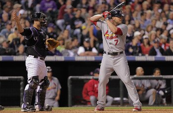 DENVER, CO - MAY 27:  Catcher Chris Iannetta #20 of the Colorado Rockies calls for a pitch out as they intentionally walk pinch hitter Matt Holliday #7 of the St. Louis Cardinals at Coors Field on May 27, 2011 in Denver, Colorado.  (Photo by Doug Pensinge