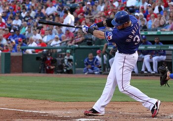 ARLINGTON, TX - JUNE 24:  Josh Hamilton #32 of the Texas Rangers hits a two-run homerun against the New York Mets in the first inning at Rangers Ballpark in Arlington on June 24, 2011 in Arlington, Texas.  (Photo by Ronald Martinez/Getty Images)