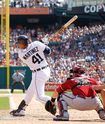 DETROIT - JUNE 26: Victor Martinez #41 of the Detroit Tigers singles to deep center field scoring Magglio Ordonez #30 in the eight inning of the game against the Arizona Diamondbacks at Comerica Park on June 26, 2011 in Detroit, Michigan. The Tigers defea