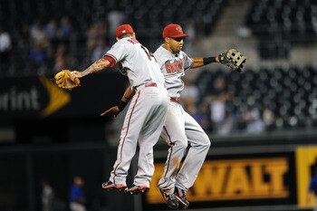 KANSAS CITY, MO - JUNE 23:  Ryan Roberts #14 of the Arizona Diamondbacks celebrates with Justin Upton #10 following a win against the Kansas City Royals at Kauffman Stadium on June 23, 2011 in Kansas City, Missouri. (Photo by G. Newman Lowrance/Getty Imag