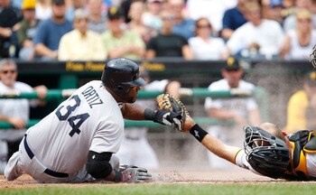 PITTSBURGH - JUNE 26:  David Ortiz #34 of the Boston Red Sox slides safely past Eric Fryer #69 of the Pittsburgh Pirates during the game on June 26, 2011 at PNC Park in Pittsburgh, Pennsylvania.  (Photo by Jared Wickerham/Getty Images)