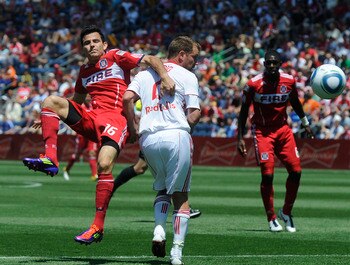 BRIDGEVIEW, IL - JUNE 26: Teemu Tainio #2 of the New York Red Bulls and Marco Pappa  #16 of the Chicago Fire fight for the ball in an MLS match on June 26, 2011 at Toyota Park in Bridgeview, Illinois.  (Photo by David Banks/Getty Images)