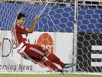 FRISCO, TX - JUNE 25: Ruben Luna #34 of the FC Dallas hangs onto the Portland Timbers goal net after teammate Jackson Goncalves #6 (not pictured) scored during the second half of a soccer game at Pizza Hut Park on June 25, 2011 in Frisco, Texas. FC Dallas