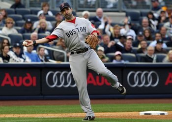 NEW YORK - SEPTEMBER 26:  Mike Lowell #25 of the Boston Red Sox throws against the New York Yankees on September 26, 2009 at Yankee Stadium in the Bronx borough of New York City.  (Photo by Jim McIsaac/Getty Images)