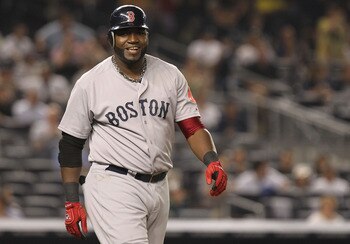 NEW YORK, NY - JUNE 09:  David Ortiz #34 of the Boston Red Sox smiles after he walks to first after being hit by a pitch against the New York Yankees on June 9, 2011 at Yankee Stadium in the Bronx borough of New York City.  (Photo by Nick Laham/Getty Imag