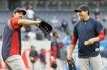 NEW YORK, NY - MAY 14:  Adrian Gonzalez #28 (L) and Jacoby Ellsbury #2 of the Boston Red Sox warm up before playing the New York Yankees on May 14, 2011 at Yankee Stadium in the Bronx borough of New York City.  (Photo by Jim McIsaac/Getty Images)