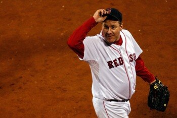 BOSTON - OCTOBER 20:  Starting pitcher Curt Schilling #38 of the Boston Red Sox tips his hat to the crowd after closing out the seventh inning against the Cleveland Indians during Game Six of the American League Championship Series at Fenway Park on Octob