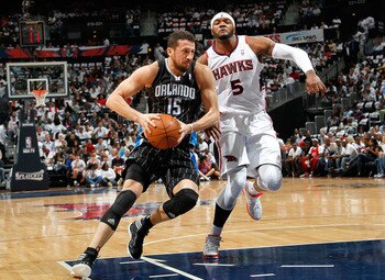 ATLANTA, GA - APRIL 28:  Hedo Turkoglu #15 of the Orlando Magic against Josh Smith #5 of the Atlanta Hawks during Game Six of the Eastern Conference Quarterfinals in the 2011 NBA Playoffs at Philips Arena on April 28, 2011 in Atlanta, Georgia.  NOTE TO US