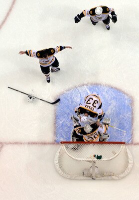 VANCOUVER, BC - JUNE 15:  Brad Marchand #63 of the Boston Bruins celebrates with his teammates Tim Thomas #30, Rich Peverley #49 and Zdeno Chara #33 after defeating the Vancouver Canucks in Game Seven of the 2011 NHL Stanley Cup Final at Rogers Arena on J