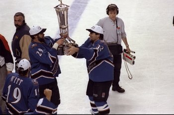 4 Jun 1998:  Joe Reekie #29 and Dale Hunter #32 of the Washington Capitals holding the tropie after winning the Eastern Conference Finals game against the Buffalo Sabres at the Marine Midland Arena in Buffalo, New York.  The Capitals defeated the Sabres 3