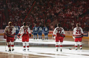 RALEIGH, NC - MAY 25:  Defenseman Glen Wesley #2, left wing Bates Battaglia #13, center Rod Brind'Amour #17 and left wing Erik Cole #26 of the Carolina Hurricanes stand on the ice for the national anthems before game five of the Eastern Conference finals