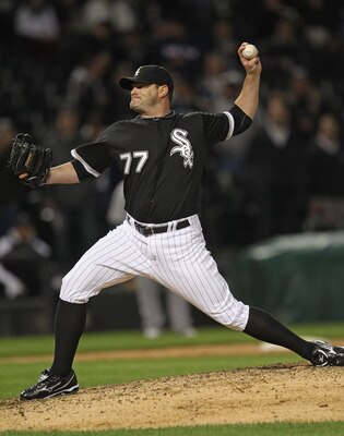 CHICAGO, IL - JUNE 09:  Will Ohman #77 of the Chicago White Sox pitches against the Oakland Athletics at U.S. Cellular Field on June 10, 2011 in Chicago, Illinois. The Athletics defeated the White Sox 7-5.  (Photo by Jonathan Daniel/Getty Images)