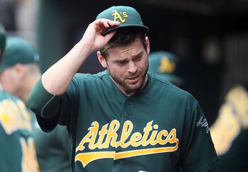 NEW YORK, NY - JUNE 23:  Graham Godfrey #65 of the Oakland Athletics looks on from the dugout after leaving the game against the New York Mets in the sixth inning at Citi Field on June 23, 2011 in the Flushing neighborhood of the Queens borough of New Yor