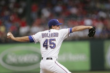 ARLINGTON, TX - JUNE 20: Derek Holland #45 of the Texas Rangers pitches against the Houston Astros at Rangers Ballpark in Arlington on June 20, 2011 in Arlington, Texas.  (Photo by Rick Yeatts/Getty Images)