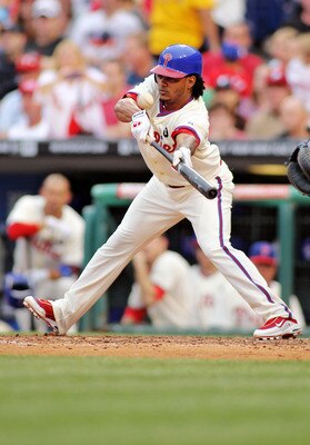 PHILADELPHIA , PA - JUNE 11:  Michael Martinez #19 of the Philadelphia Phillies lays down a bunt against the Chicago Cubs the Phillies defeated the Cubs 7-1 at Citizens Bank Park on June 11, 2011 in Philadelphia, Pennsylvania.  (Photo by Len Redkoles/Gett